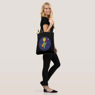 El principito admirando su rosa tote bag