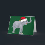 Elefant kerstmis in Santa Hat Holiday Kaart<br><div class="desc">Vakantiesdieren zijn mijn favoriete deel van Kerstmis. Een mooie grijze olifant met een rode Santa-hoed die er gelukkig uitziet op een feestelijke groene achtergrond. Dit vult me met de kerstsfeer.</div>