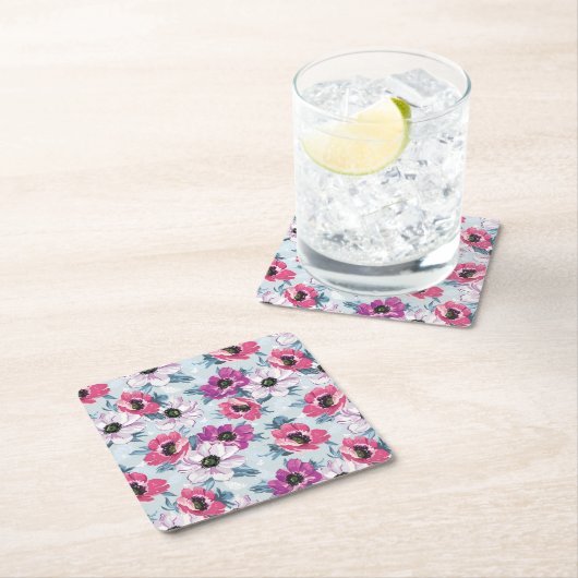 Elegance kleurenbloemen patroon op blauw kartonnen onderzetters (Insitu)