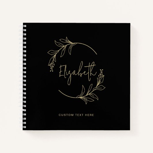 Elegant bloemenkrans monogram zwart goud notitieboek (Voorkant)