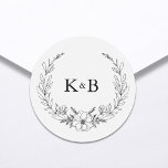 Elegant Floral Wreath Monogram Wedding Ronde Sticker<br><div class="desc">Personaliseer eenvoudig uw trouwstickers met dit bewerkbare ontwerp. Beschikt over een minimaal elegant typografisch ontwerp in zwart-witte kleur met een aangepast monogram,  omgeven door een bloemenkrans illustratie.</div>