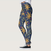 Elegant geel bloemmotief op blauw leggings (Links)