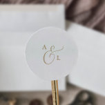 Elegant Gold Script Monogram Wedding Envelope Seal Ronde Sticker<br><div class="desc">Deze elegante gouden monogram bruiloftsenvelopzegels zijn perfect voor een eenvoudige bruiloft. Het minimalistische goud- en witte design is uitgerust met fancy romantische typografie met moderne glazen stijl. in elke kleur. Houd het ontwerp minimaal en vaag, zoals het is, of pas het aan door uw eigen afbeeldingen en illustraties toe te...</div>