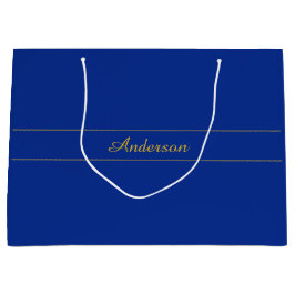 Elegant gouden script op de blauwe achtergrond van groot cadeauzakje