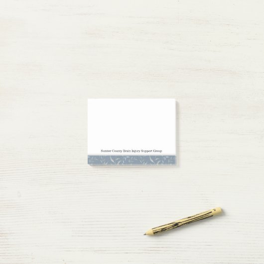 Elegant grijs blad op  blauw post-it® notes (Op bureau)
