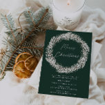Elegant groen wit bloemenkrans kerstfeest kaart<br><div class="desc">Elegante Green and White Floral Wreath Christmas Party uitnodiging Nodig je vrienden en familie uit voor je jaarlijkse kerstfeest met deze elegante en verfijnde uitnodiging. Het ontwerp is geplaatst tegen een diepgroene achtergrond en heeft een prachtige witte bloemenkrans rond de woorden "Vrolijk kerstfeest". Details van het evenement worden hieronder duidelijk...</div>