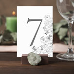 Elegant Lily Floral Wedding Table Number Card Kaart<br><div class="desc">Add a graceful finishing touch to your reception tables with this elegant floral wedding table number card. Featuring delicate lily line-art illustrations along the edge, the design blends timeless botanical beauty with a clean, minimalist layout that feels both modern and sophisticated. The bold table number stands prominently at the center,...</div>