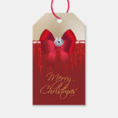 Elegant luxueus rood satijnstrik op gouden kerst cadeaulabel (Voorkant)