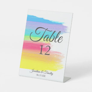Elegant regenboogrondzendmonogram reclamebord met voetstuk