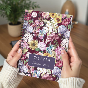 Elegant rood geel bloemmotief met monogram notitieboek