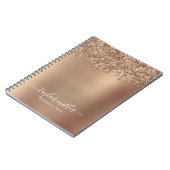 Elegant stijlvol roos goudglitter make-up en haar notitieboek (Linkerzijde)