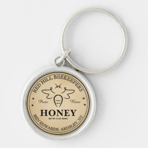 Elegant vintage bewerkbare honingpot bij label sleutelhanger