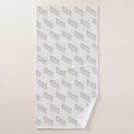 Elegant white and gold cutlery arranged diagonally badhanddoek