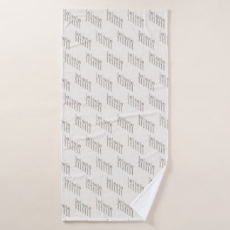 Elegant white and gold cutlery arranged diagonally badhanddoek