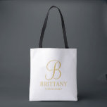 Elegant White en Gold Specialized Bridesmaid Tote Bag<br><div class="desc">Elegant Gepersonaliseerde Bridesmaid Gifts met gepersonaliseerd monogram in gouden elegante stijl van de manuscriptdoopvont met de naam en de titel van de bruidsmeisje in gouden klassieke stijl van de serif doopvont. Ook perfect voor Maid of Honor, Bloemenmeisje, moeder van de Bride en nog veel meer. Opmerking: de details van de...</div>