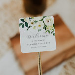 Elegant White Floral Wedding Welcome Vierkante Sticker<br><div class="desc">Deze elegante witte florale bruiloft welkome stickers zijn perfect voor een klassieke bruiloft. Het moderne ontwerp is voorzien van prachtig romantisch roos van ivoor en roomkleurige waterverf en pony's met donkergroene bladeren, groene bladeren en botanische producten. Pas deze stickers aan met de locatie van je bruiloft, namen en trouwdatum. Deze...</div>