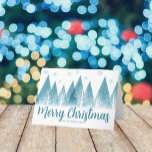 Elegant Winter Trees Custom Blue Merry Kerstmis Feestdagen Kaart<br><div class="desc">Een elegante rij winterbomen en sneeuwvlokken boven je gepersonaliseerde Merry kerstscript en je familienaam in  blauw onder het sneeuwgevulde bos. Een moderne vakantiekaart met je aangepaste bericht.</div>