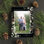 Elegant Winter Watercolor Greenery Botanical Photo Feestdagenkaart<br><div class="desc">This elegant holiday photo card features a single vertical photo framed by beautiful watercolor eucalyptus, holly, and berries over a chic black background. The editable greeting on the front says "Happy Holidays". The back of the card is a coordinating foliage pattern, which can be removed if desired. You can also...</div>