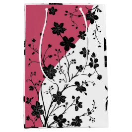 Elegant zwart bloemensilhouet op roze en wit medium cadeauzakje