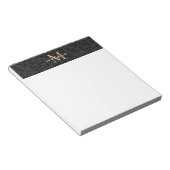 Elegant zwart gouden bloemenscript monogram notitieblok (Schuin)