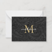 Elegant zwart gouden bloemenscript monogram notitiekaartje (Voorkant)