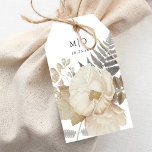 Elegante aardachtige bloemige chique witte bruilof cadeaulabel<br><div class="desc">Dit prachtige bruiloft gunst label heeft een neutrale kleur bloemenillustratie,  een klassieke witte achtergrond,  en elegante typografie met uw initialen en bruiloft datum. Op de achterkant kan een persoonlijk bericht worden aangepast. Dit elegante ontwerp is een fantastische keuze voor vele soorten evenementen,  van klassiek tot boho.</div>