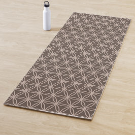 Elegante bloem des levens op bruine achtergrond yogamat