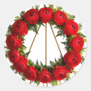 Elegante bloemenkrans versierd met rode rozen ronde sticker
