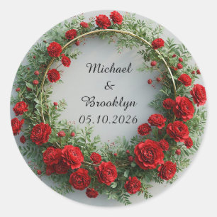 Elegante bloemenkrans versierd met rode rozen ronde sticker