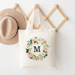 Elegante Blush en Witte Bloemkrans Monogram Tote Bag<br><div class="desc">Verhoog je tas spel met onze stijlvolle Blush Floral gepersonaliseerde canvas tassen. De elegante canvas tas is voorzien van uw aangepaste monogram of initiaal, omringd door een krans van blush roze en witte waterverf bloemen, aangevuld met weelderig groen. De bloemenkrans canvas tassen zijn perfect voor de aanstaande bruid, bruidsmeisje, moeder...</div>