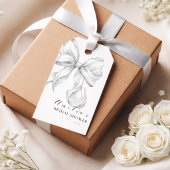 Elegante, de knoop leggende witte bruidsboog. cadeaulabel
