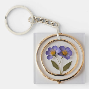 Elegante geperste bloemenvelg met gouden Sleutelha Sleutelhanger