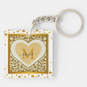 Elegante gouden glinsterende hart initiaal en naam sleutelhanger