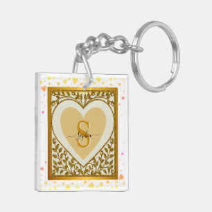 Elegante gouden glinsterende hart initiaal en naam sleutelhanger