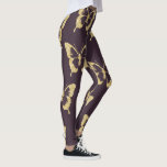 Elegante gouden glitter vlinder leggings<br><div class="desc">Modern en stijlvol ontwerp met faux gouden glittervlinders op een paarse achtergrond.</div>