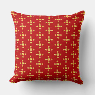 Elegante gouden polka stippen op rood kussen