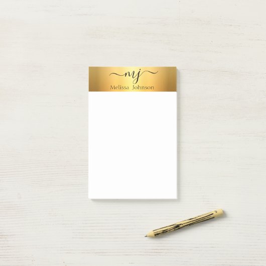 Elegante initialen op goud post-it® notes (Op bureau)