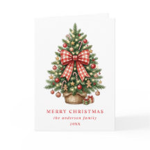 Elegante kerstboom met rode gingham strik in water