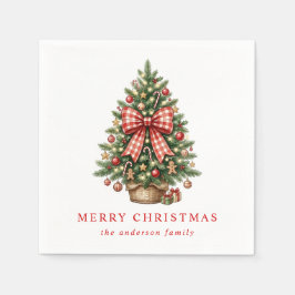 Elegante kerstboom met rode gingham strik in water servet