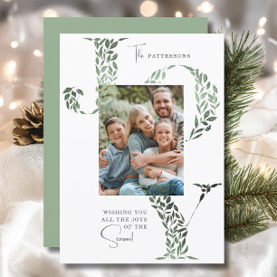 Elegante kersttypografie met bloemen foto feestdagenkaart