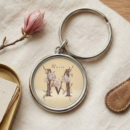 Elegante Maeve M initiële magnolia bloemendesign Sleutelhanger