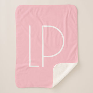 Elegante minimalistische moderne initiaal op paste sherpa deken