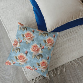Elegante perzikrozen op blauwe achtergrond kussen