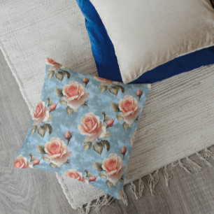 Elegante perzikrozen op blauwe achtergrond kussen