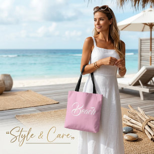 Elegante strandtekst markering zachte roze tote on bag