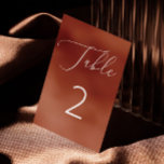 Elegante Terracotta Brick Minimalistische Fall Wed Kaart<br><div class="desc">Deze elegante tafelnummerkaart heeft een verbrande sienna-achtergrond, met een delicaat wit script en schone typografie voor een warme, verfijnde look. De warme terracotta bakstenen kleur voegt een gezellige, herfst gevoel aan uw decor, terwijl zachte roest klei toon maakt het perfect voor de herfst bruiloften, boho thema's, of rustieke evenementen. Dit...</div>