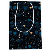 Elegante vallende kosmische harten in blauw en gou medium cadeauzakje (Voorkant)