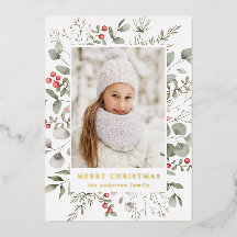 Elegante winterloof en hulstbessen foto