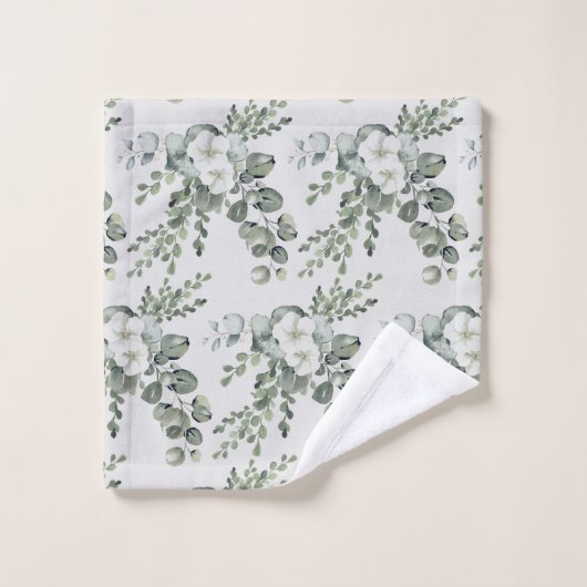 Elegante witte bloemen en groene handdoek (Wasdoekje)