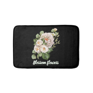 Elegante witte bloemenboeket met groene bladeren badmat